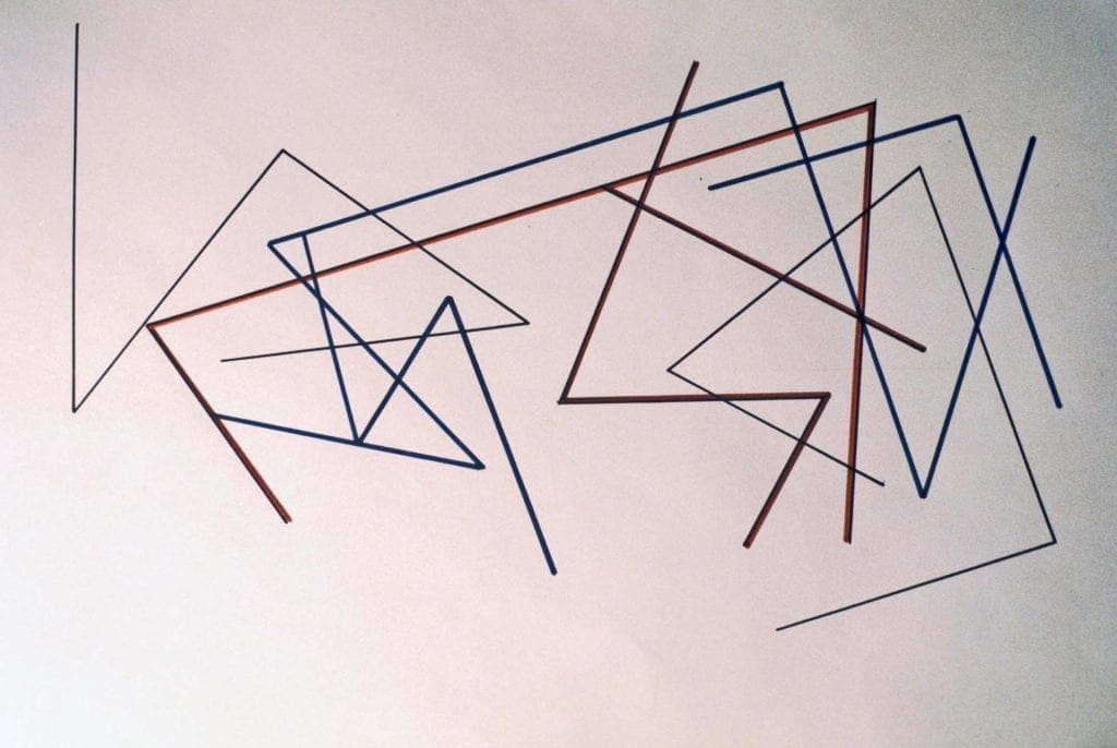 A wall with many lines drawn on it