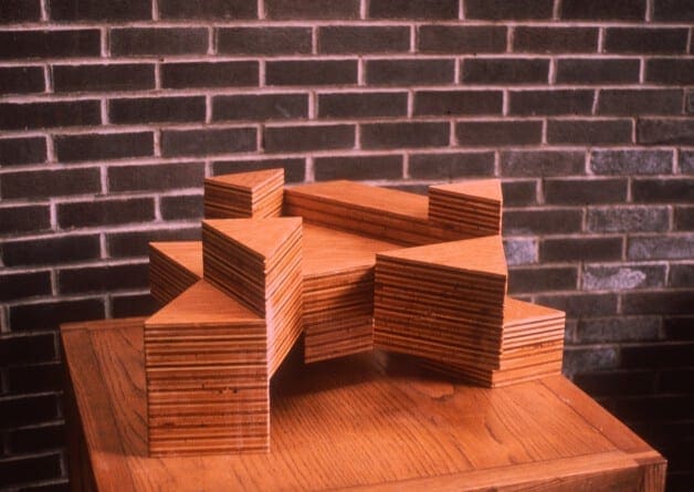 A wooden table with some stacks of wood