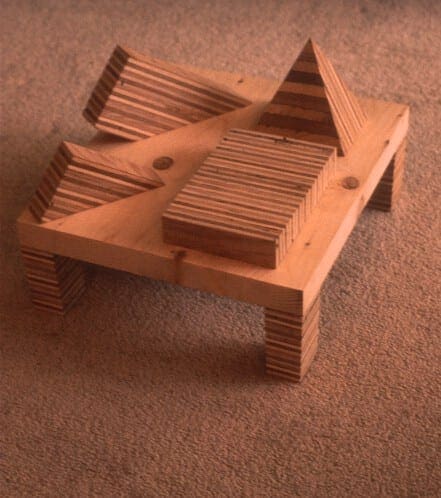 A wooden table with some pieces of wood on it