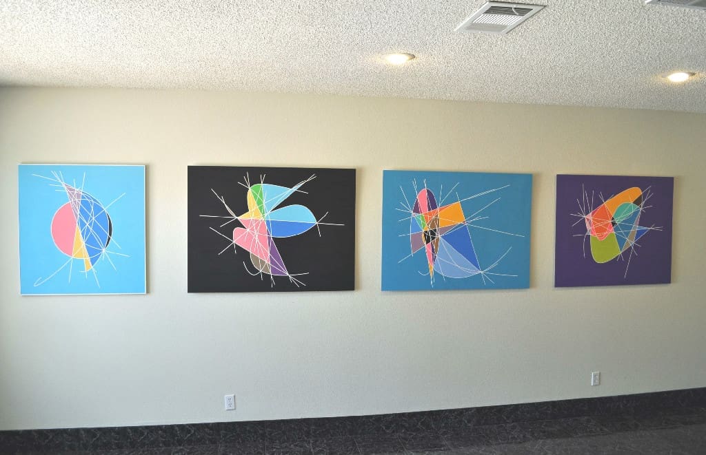 Four paintings on a wall