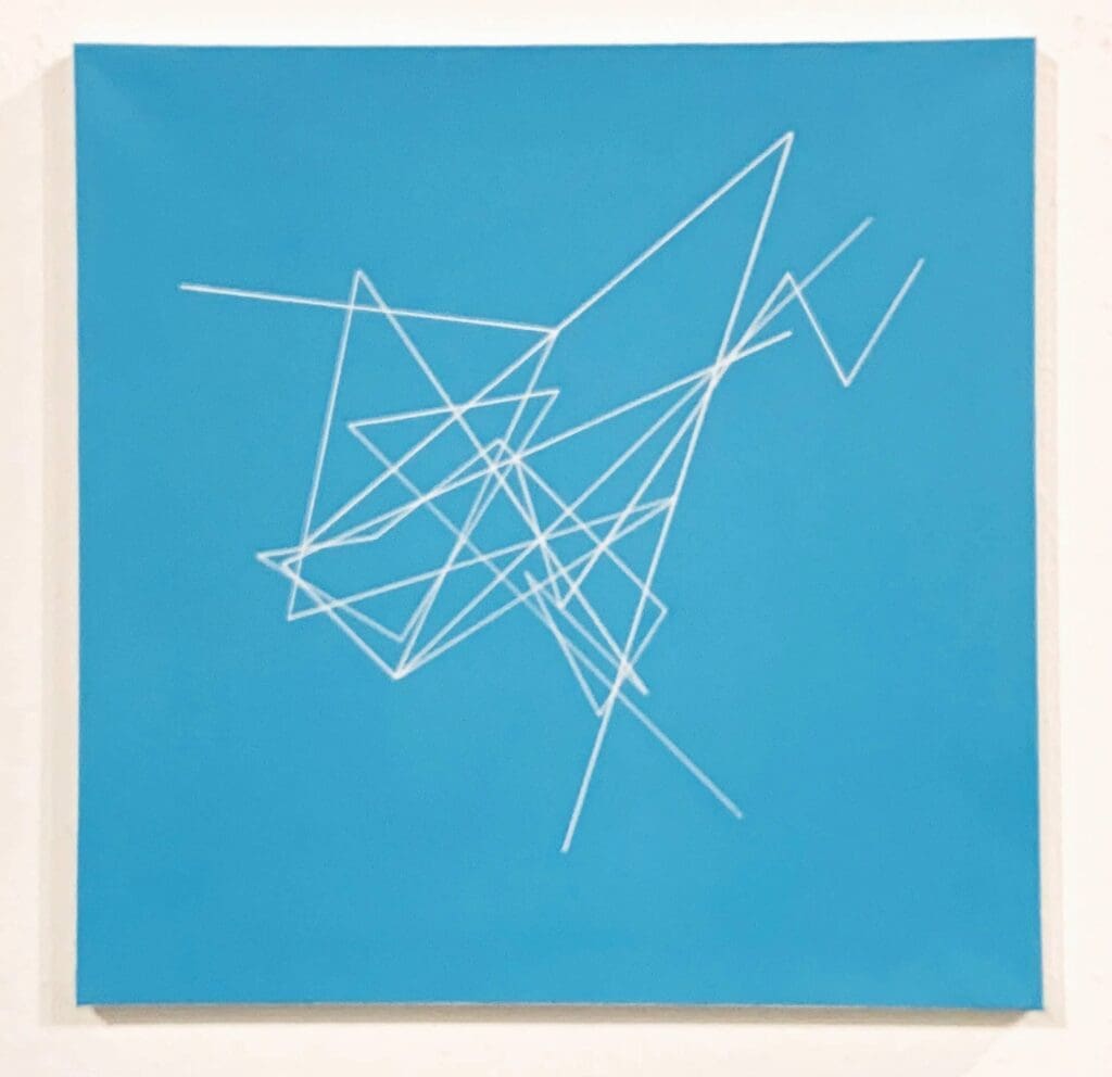 Turquoise canvas with intersecting white geometric lines