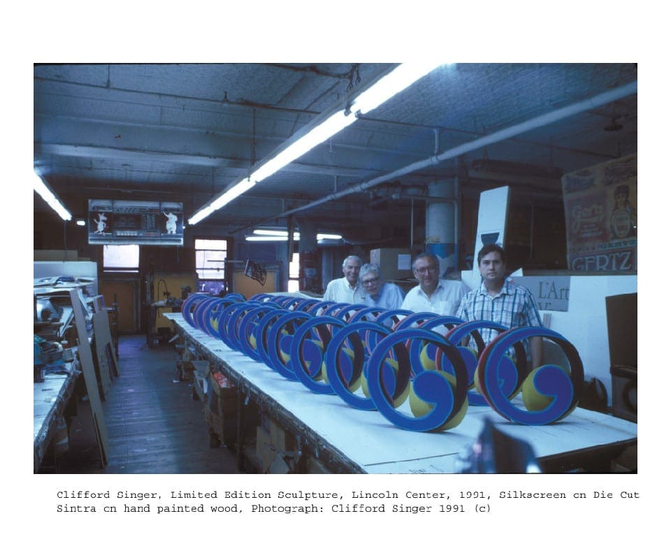 A group of men sitting in front of plates.