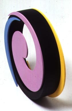 A sculpture of a circle with three different colors.