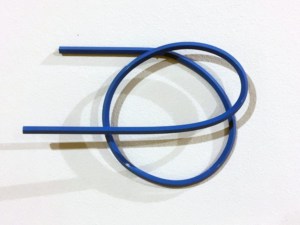 Curved blue strip forming overlapping loops