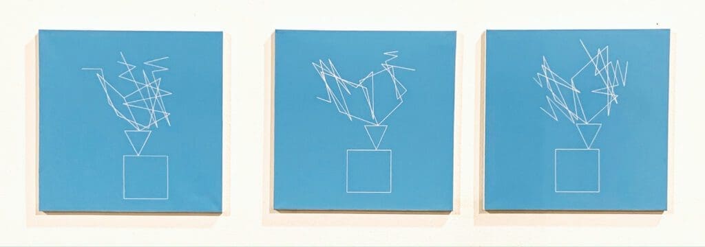Three turquoise squares featuring white abstract forms
