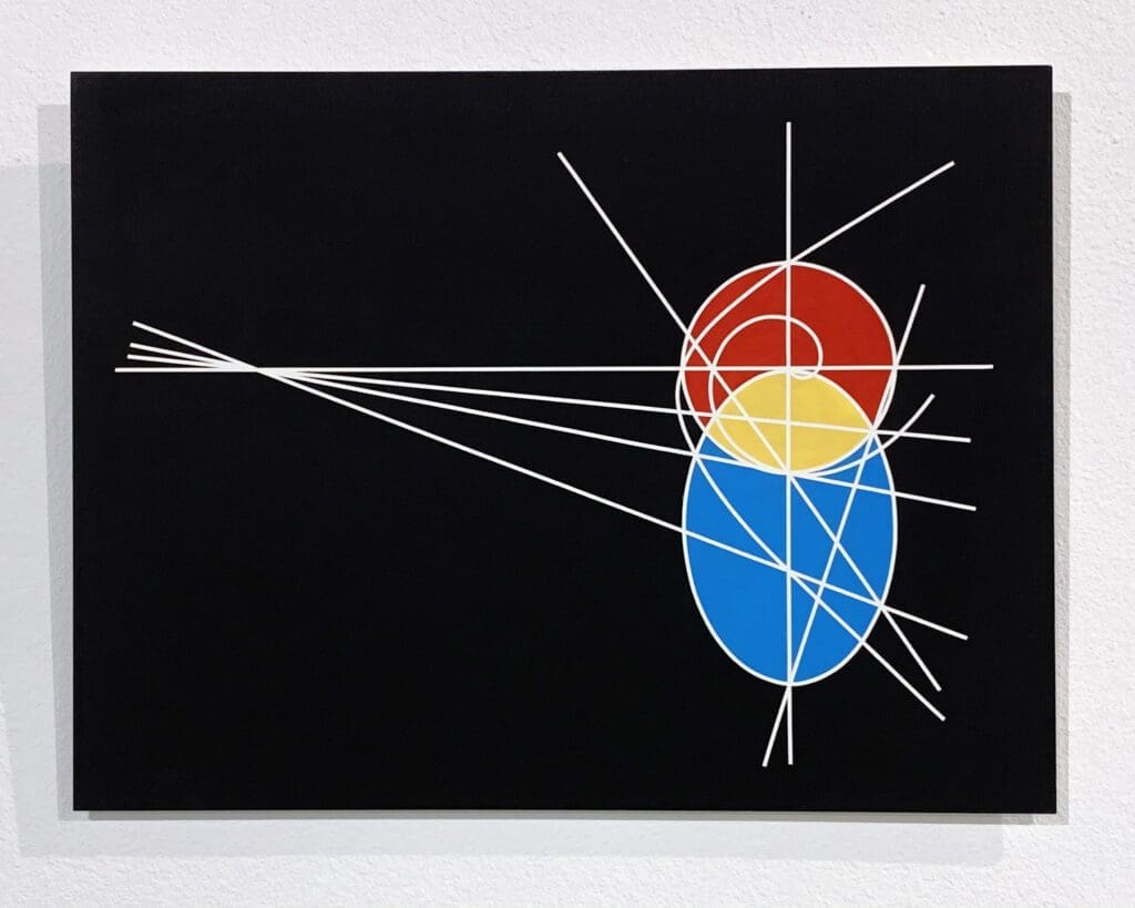 Black background with red, yellow, blue ovals