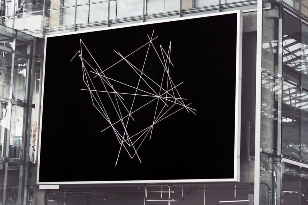 White linear sketch on black billboard in atrium