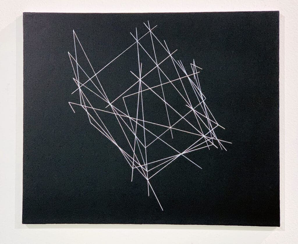 Abstract white lines intersecting on a black background forming geometric shapes.