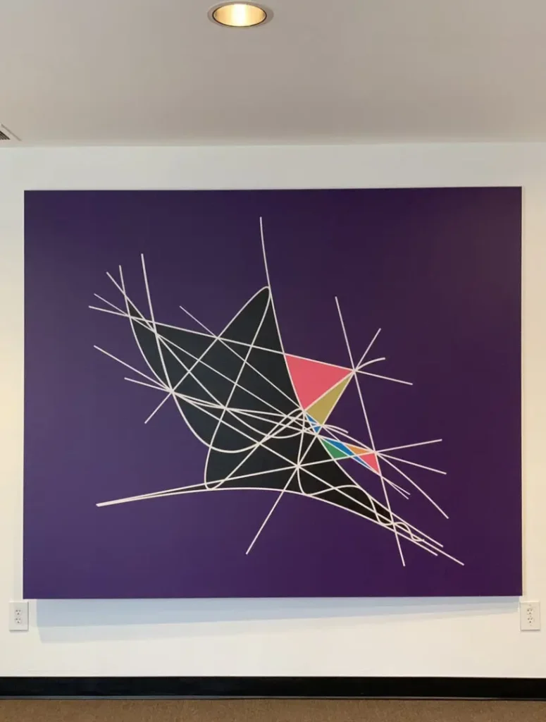 Abstract geometric art with intersecting lines and colorful shapes on a purple background.