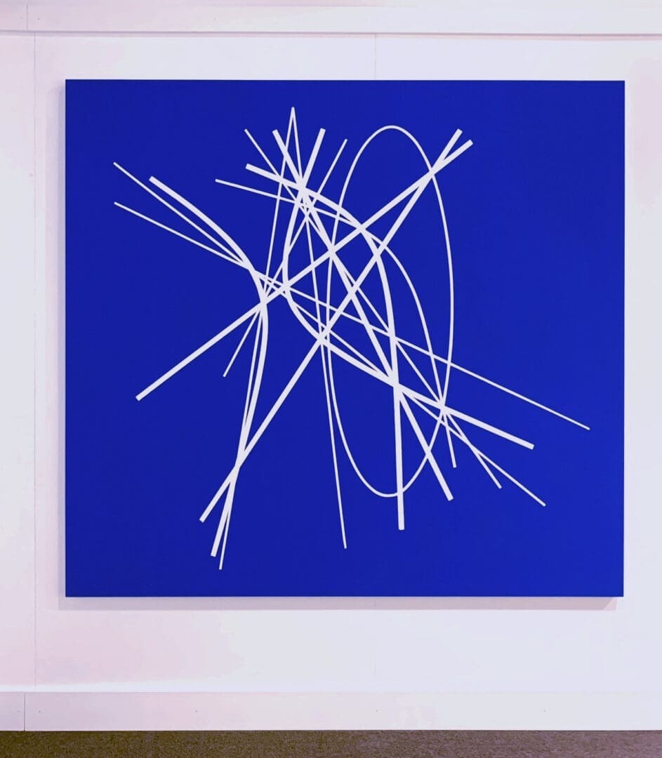 A blue painting with white lines on it