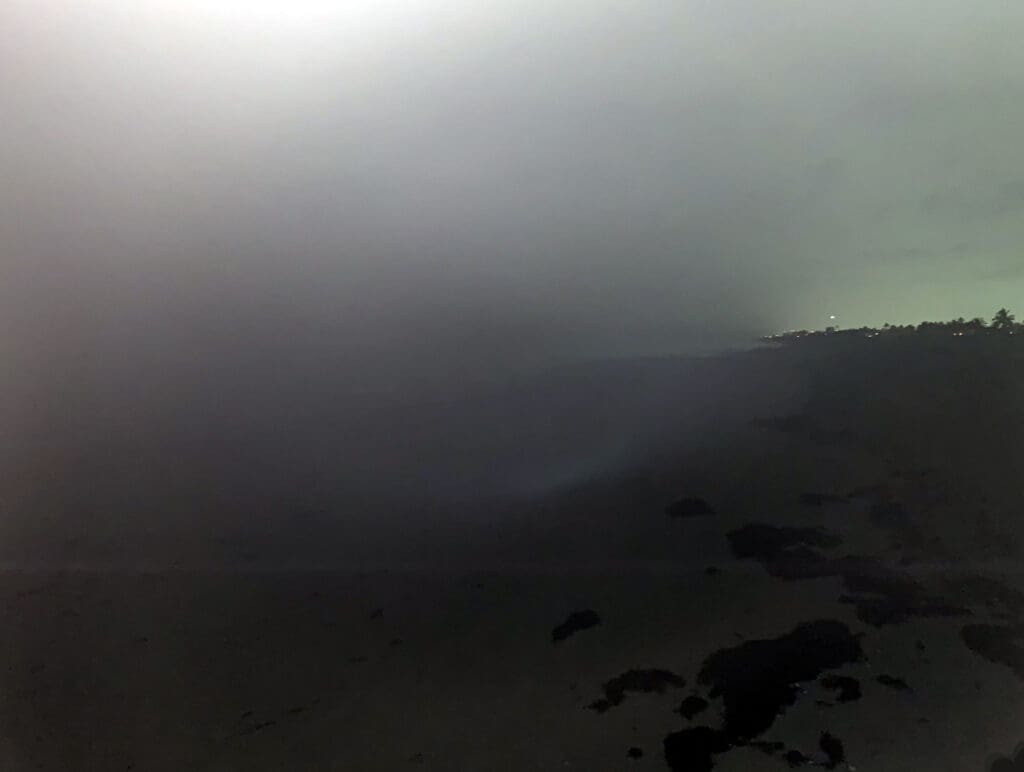 Foggy landscape with low visibility and rocky terrain.