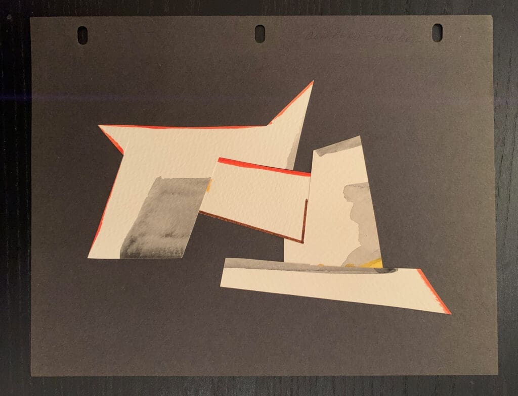 Abstract geometric shapes with muted colors and sharp edges on a dark background.