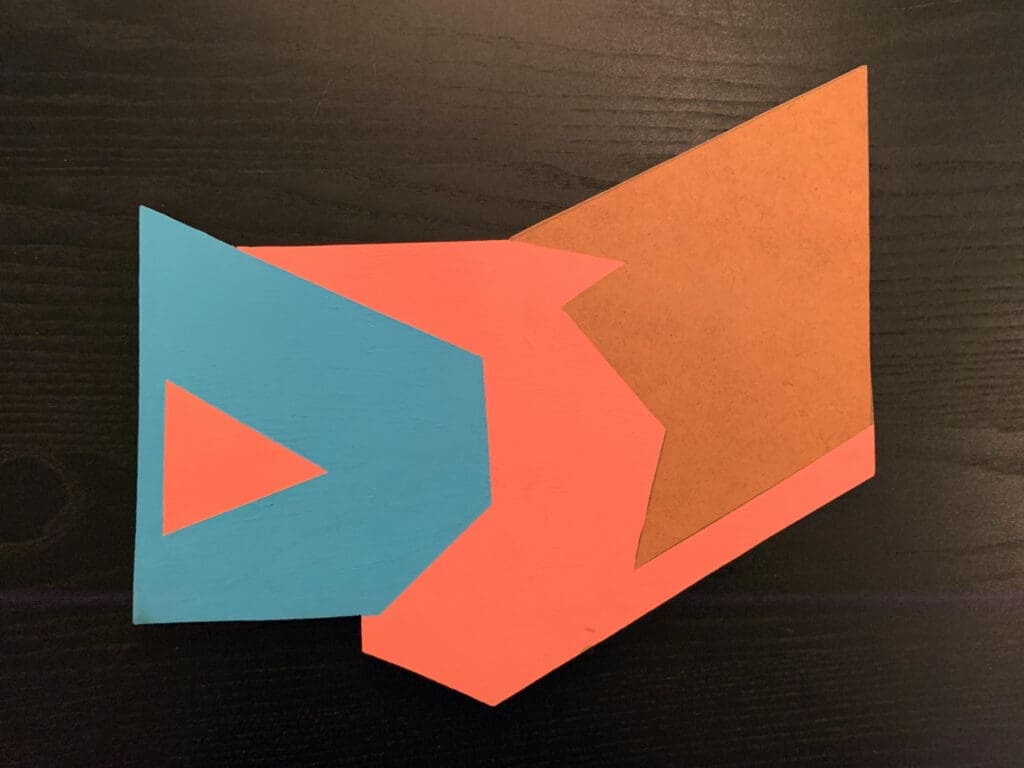 Abstract geometric shapes in blue, orange, and red on a black background.