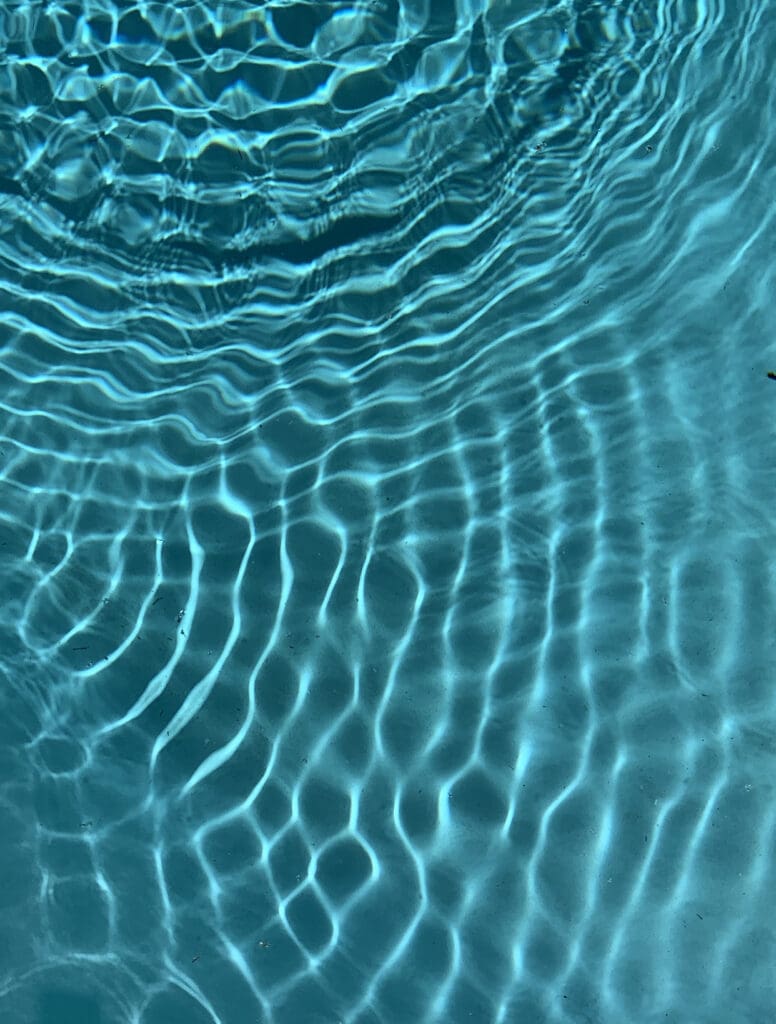 Rippling water patterns create a mesmerizing blue texture.