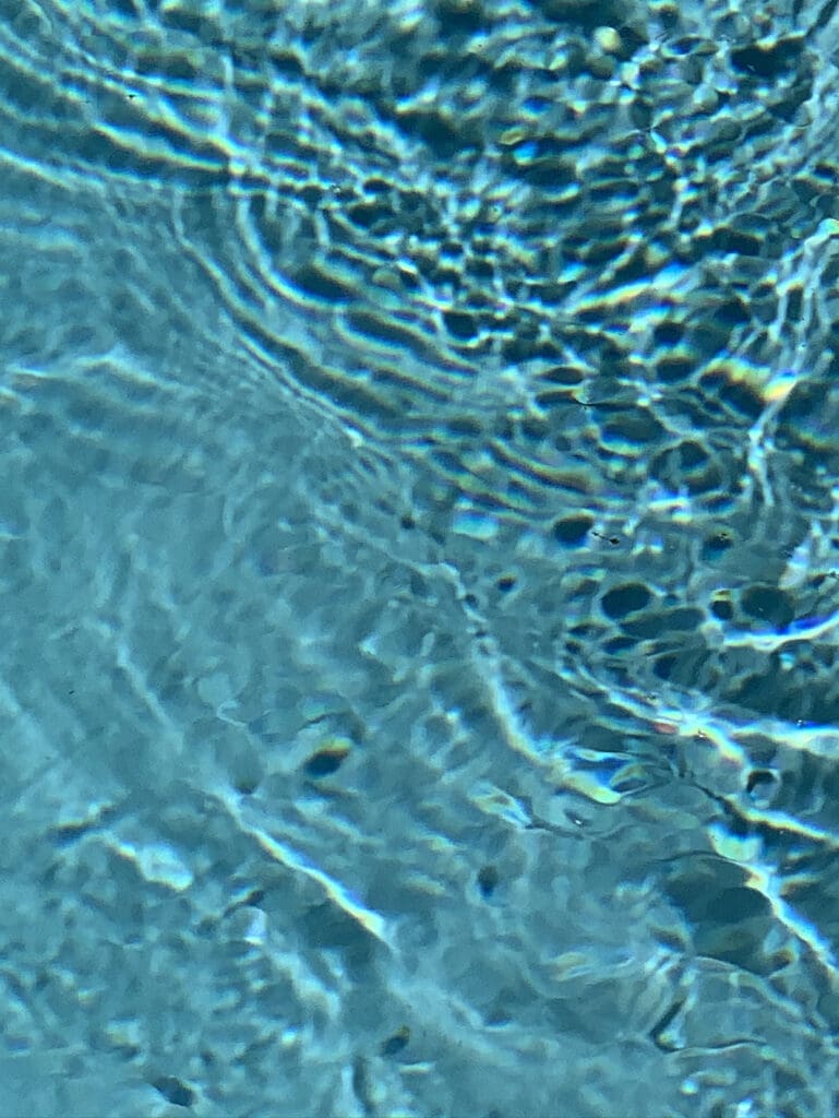 Close-up shimmering aqua light patterns