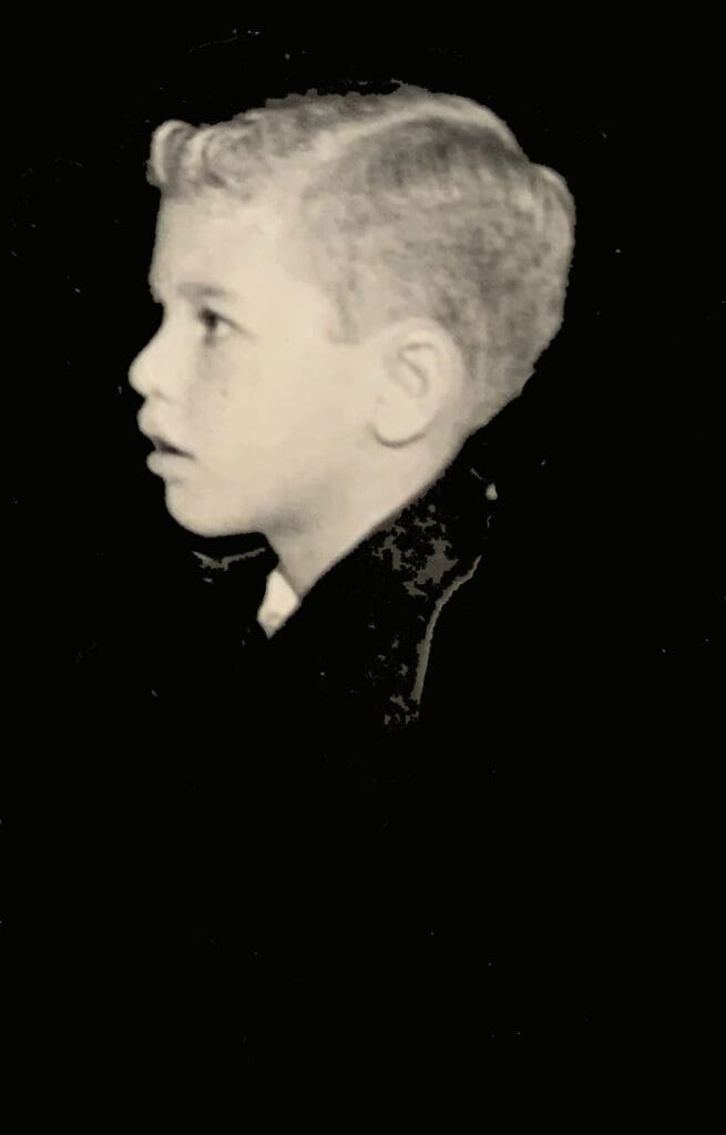 Young boy in profile, black and white.