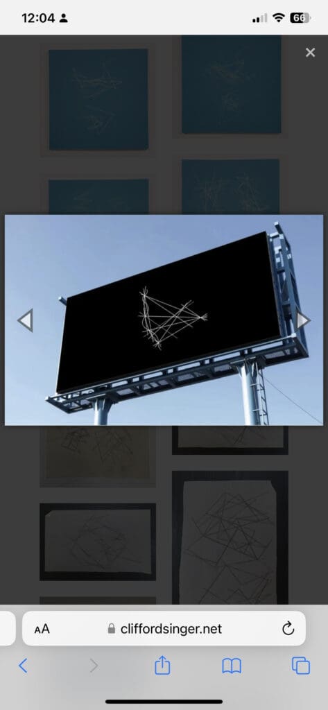 Billboard with abstract geometric design displayed.