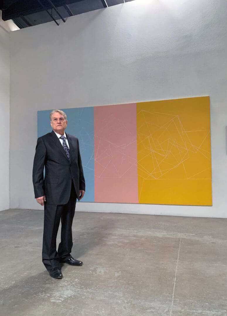 Clifford Singer. Portrait. 2024. In Front of Hyper Cube Series 1978. Photograph: Rey Fong. 2024   