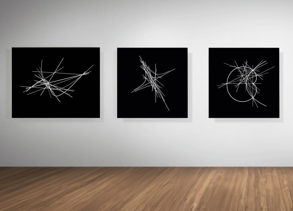 Triptych of black squares with white lines