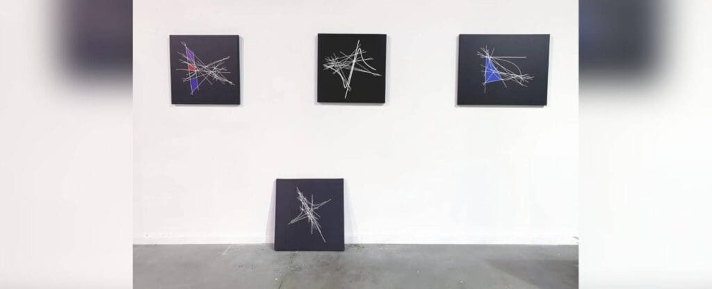 Abstract line art on gallery wall.