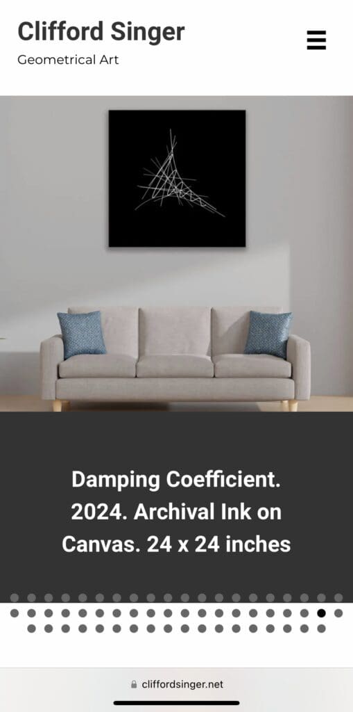 Geometrical art above a modern sofa.