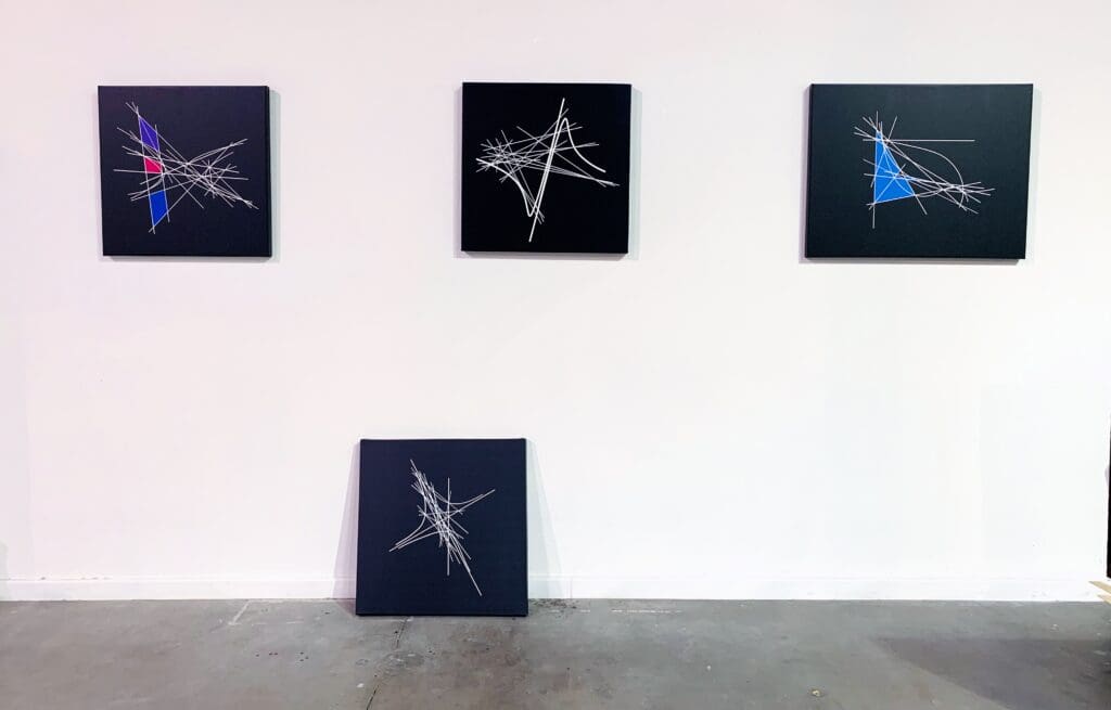 Abstract geometric art on display wall.