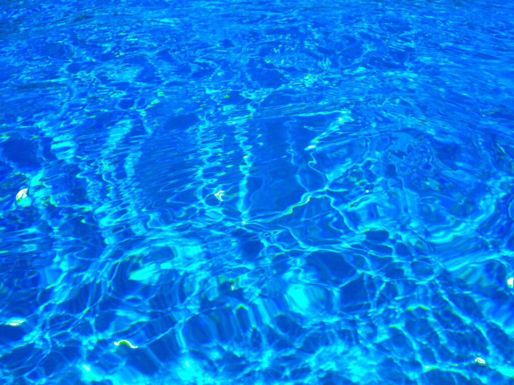 Shimmering blue water surface with ripples
