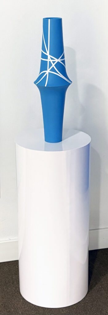 Blue tapered sculpture with white lines