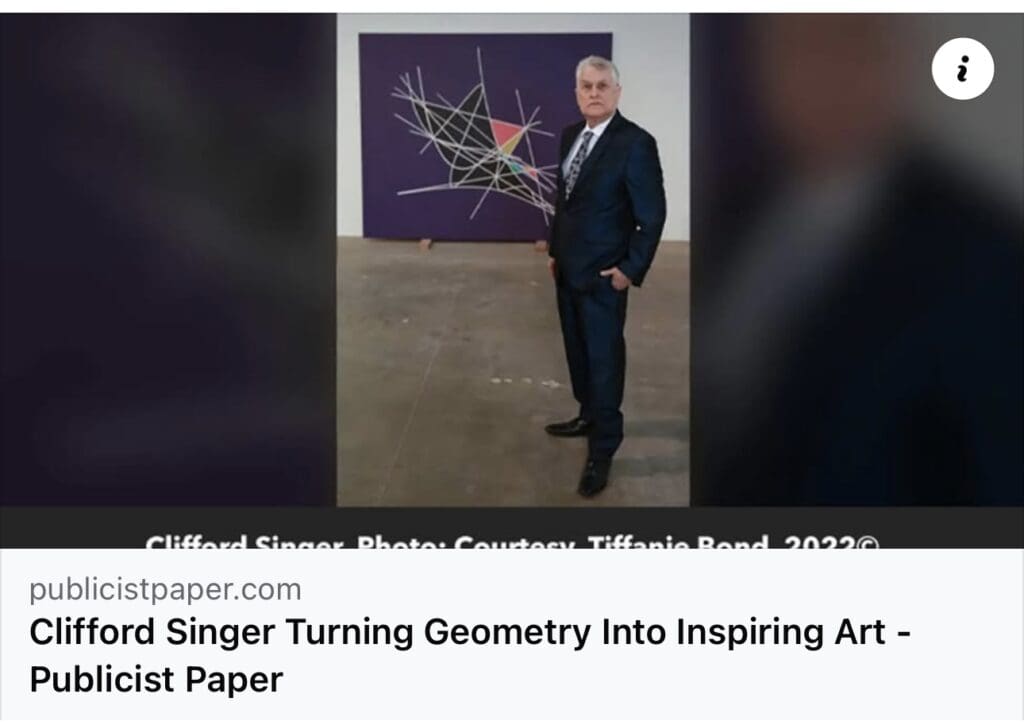 Man in suit beside abstract geometric painting