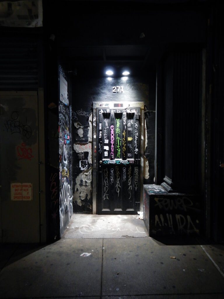 Clifford Singer. Building Entrance. NYC. 2025