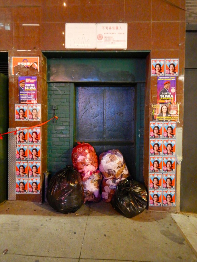 Clifford Singer. Building Entrance. Garbage. NYC. 2025