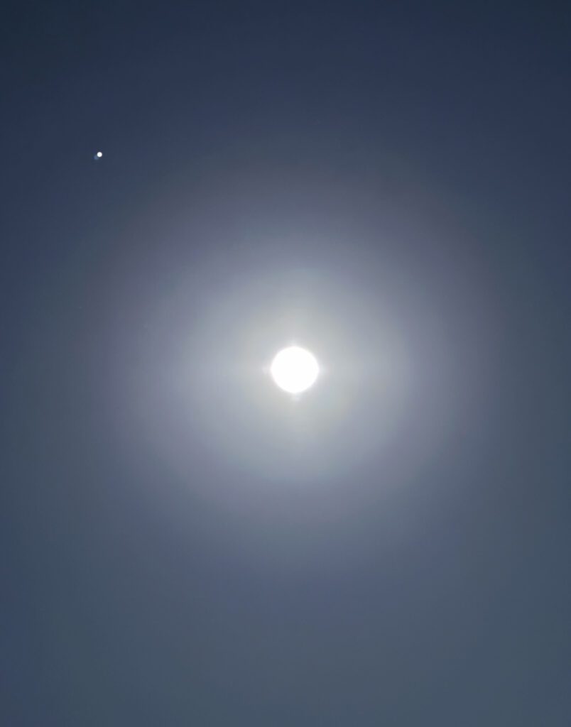 Bright full moon surrounded by faint stars