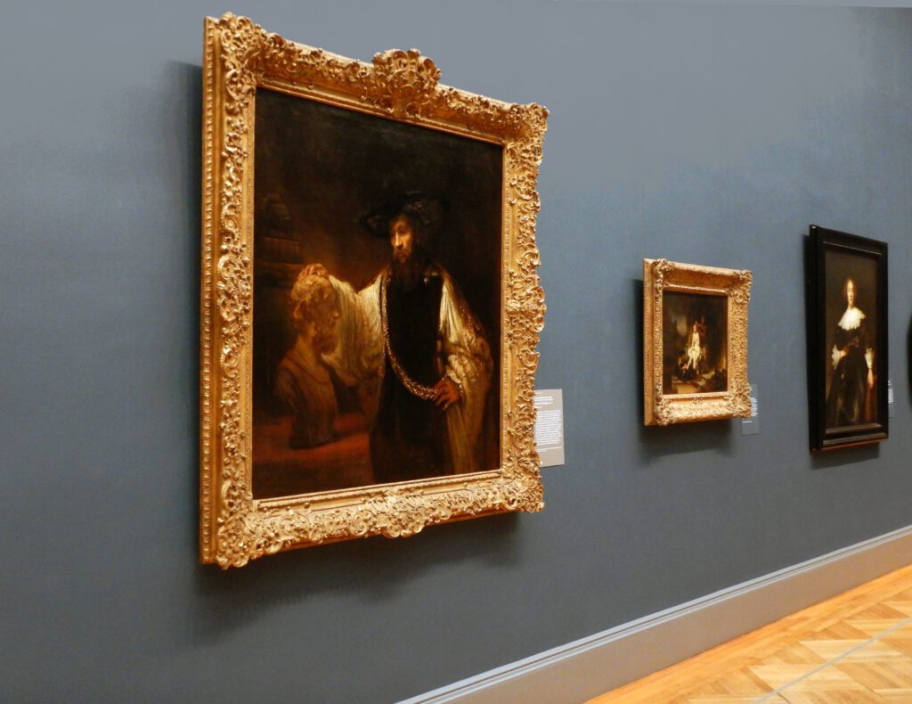 Gallery wall with framed classical paintings