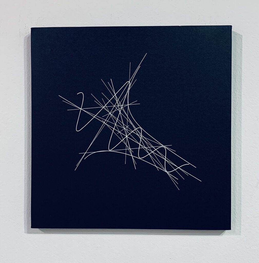 Square navy painting with looping white scribbles
