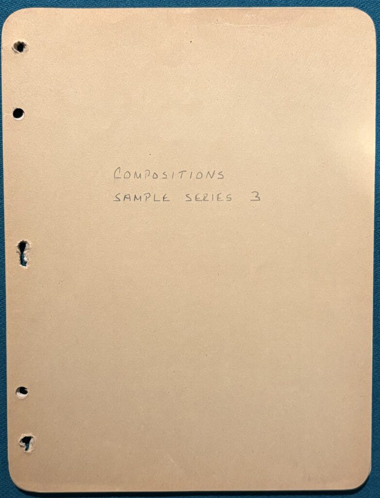 Beige notebook cover with handwritten title